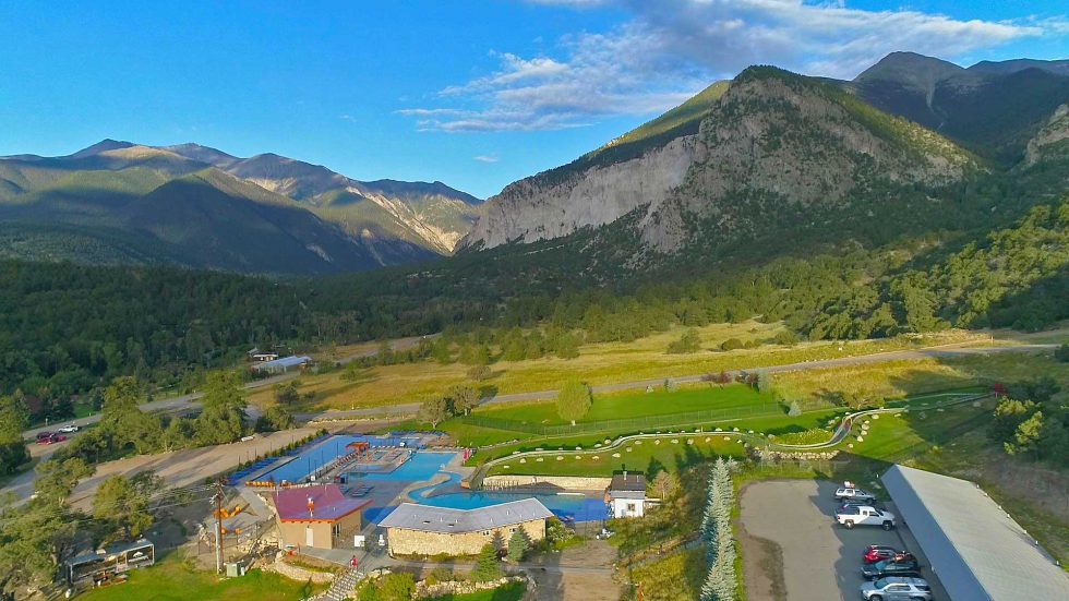 Indulge In Serenity Infinity Pool At Mount Princeton Hot Springs Resort   Summer Header Aerial Upper Hot Spring Pool 1 980x551 